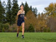 Seton Catholic sophomore Alexis Leone dashes across the grass Wednesday, Nov. 17, 2021, at Seton Catholic High School. Leone is the All-Region girls cross country runner of the year.