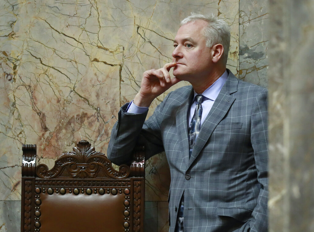 Sen. Reuven Carlyle, D-Seattle, listens as he stands on the Senate floor Friday, Feb. 15, 2019, during debate in Olympia, Wash., on a measure sponsored by Carlyle that would repeal the death penalty in Washington state. The Senate on Friday approved the measure, which will now head to the House, just months after the state's Supreme Court unanimously struck down capital punishment as arbitrary and racially biased. (AP Photo/Ted S.