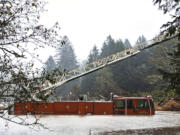 In this photo provided by the Lincoln County Sheriff's Department, a fire engine is surrounded by rising waters in Otis, Ore., Friday, Nov. 12, 2021. The U.S. Coast Guard has used two helicopters to rescue about 50 people from rising waters at an RV park on the Oregon Coast Friday as heavy rains in the Pacific Northwest prompted warnings of floods and landslides. (Sgt.