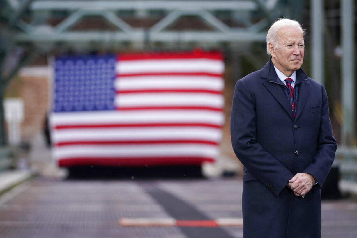 President Joe Biden waits to speak during a visit to the NH 175 bridge over the Pemigewasset River to promote infrastructure spending Tuesday, Nov. 16, 2021, in Woodstock, N.H.