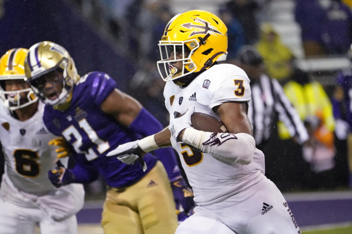 Arizona State's Rachaad White (3) runs for a touchdown against Washington during the second half of an NCAA college football game Saturday, Nov. 13, 2021, in Seattle. Arizona State won 35-30.