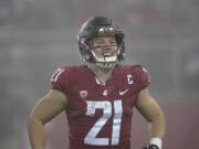 Washington State wide running back Max Borghi (21) reacts late in the second half of an NCAA college football game against Arizona, Friday, Nov. 19, 2021, in Pullman, Wash. Washington State won 44-18. (AP Photo/Ted S.