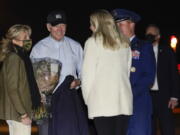 President Joe Biden and first lady Jill Biden are greeted before boarding Air Force one at Andrews Air Force Base, Md., Tuesday, Nov. 23, 2021, en route to Nantucket, Mass.