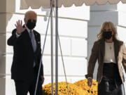 President Joe Biden, and first lady Jill Biden walk to board Marine One on the South Lawn of the White House in Washington, Saturday, Nov. 6, 2021. Biden is spending the weekend at his home in Rehoboth Beach, Del.