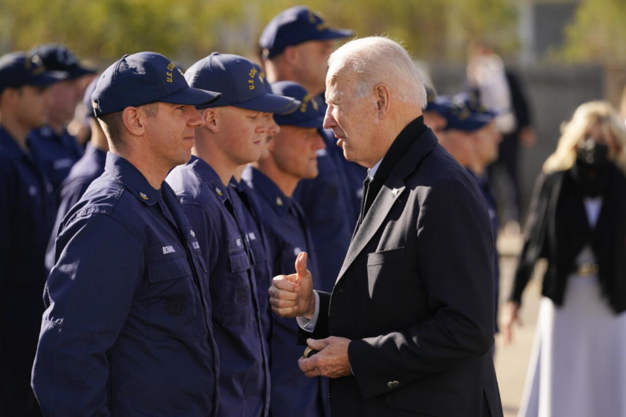 President Joe Biden speaks with members of the coast guard as he visits the United States Coast Guard Station Brant Point in Nantucket, Mass., Thursday, Nov. 25, 2021.