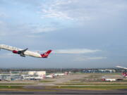 Virgin Atlantic flight VS3, front, and British Airways flight BA001 perform a synchronised departure on parallel runways at London Heathrow Airport, Monday, Nov. 8, 2021 heading for New York JFK to celebrate the reopening of the transatlantic travel corridor, more than 600 days since the US travel ban was introduced due to the Covid-19 pandemic.