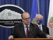 FILE - Acting Assistant U.S. Attorney General Jeffrey Clark speaks as he stands next to Deputy Attorney General Jeffrey A. Rosen during a news conference at the Justice Department in Washington, Oct. 21, 2020. Clark, who aligned himself with former President Donald Trump after he lost the 2020 election has declined to be fully interviewed by a House committee investigating the Jan. 6 Capitol insurrection, ending a deposition after around 90 minutes on Friday, Nov. 5.