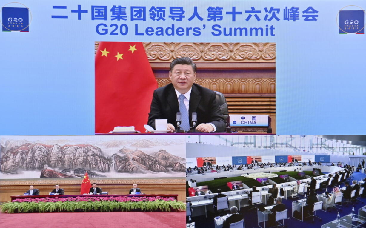 In this photo released by China's Xinhua News Agency, Chinese President Xi Jinping speaks via video link to leaders at the G20 Summit from Beijing, Sunday, Oct. 31, 2021. President Xi has been absent from the Group of 20 summit in Rome and global climate talks in Scotland, drawing criticism from U.S. President Joe Biden and questions about China's commitment to reducing greenhouse gas emissions.