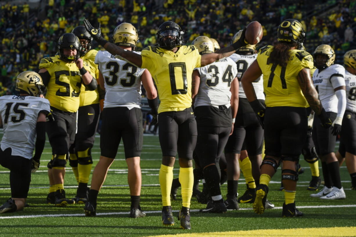 Oregon running back Seven McGee (0) celebrates his touchdown in the fourth quarter of an NCAA college football game against Colorado, Saturday, Oct. 30, 2021, in Eugene, Ore.