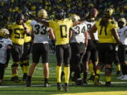 Oregon running back Seven McGee (0) celebrates his touchdown in the fourth quarter of an NCAA college football game against Colorado, Saturday, Oct. 30, 2021, in Eugene, Ore.