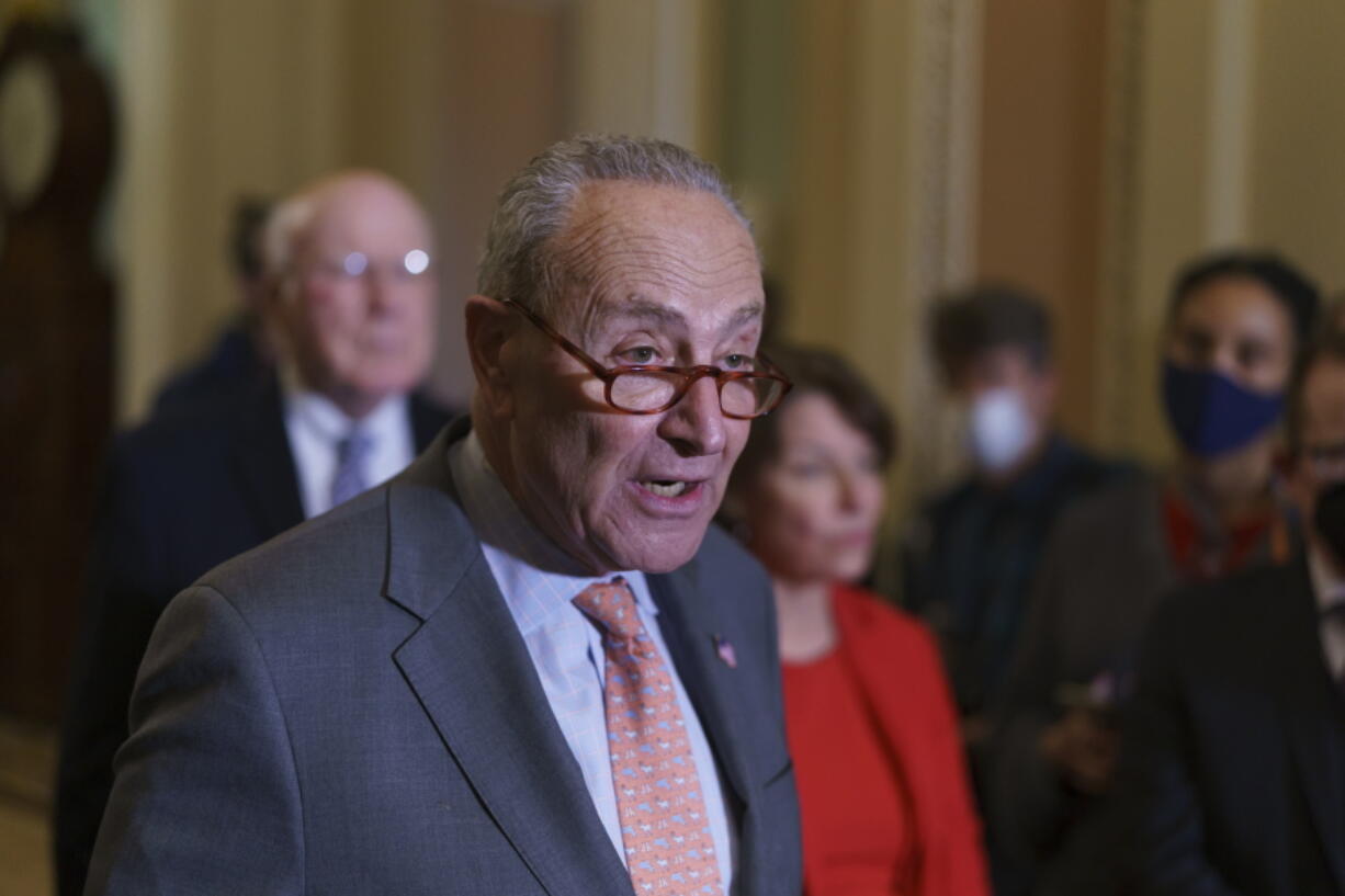 Senate Majority Leader Chuck Schumer, D-N.Y., talk about the need for the John Lewis Voting Rights Advancement Act, as he meets with reporters following a Democratic policy meeting at the Capitol in Washington, Tuesday, Nov. 2, 2021. (AP Photo/J.