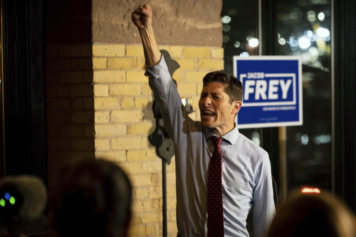 Mayor Jacob Frey throws his fist in the air as he speaks to supporters on Tuesday, Nov. 2, 2021 in Minneapolis. Minneapolis Mayor Jacob Frey risked his bid for a second term by opposing a push to replace the city's police department.