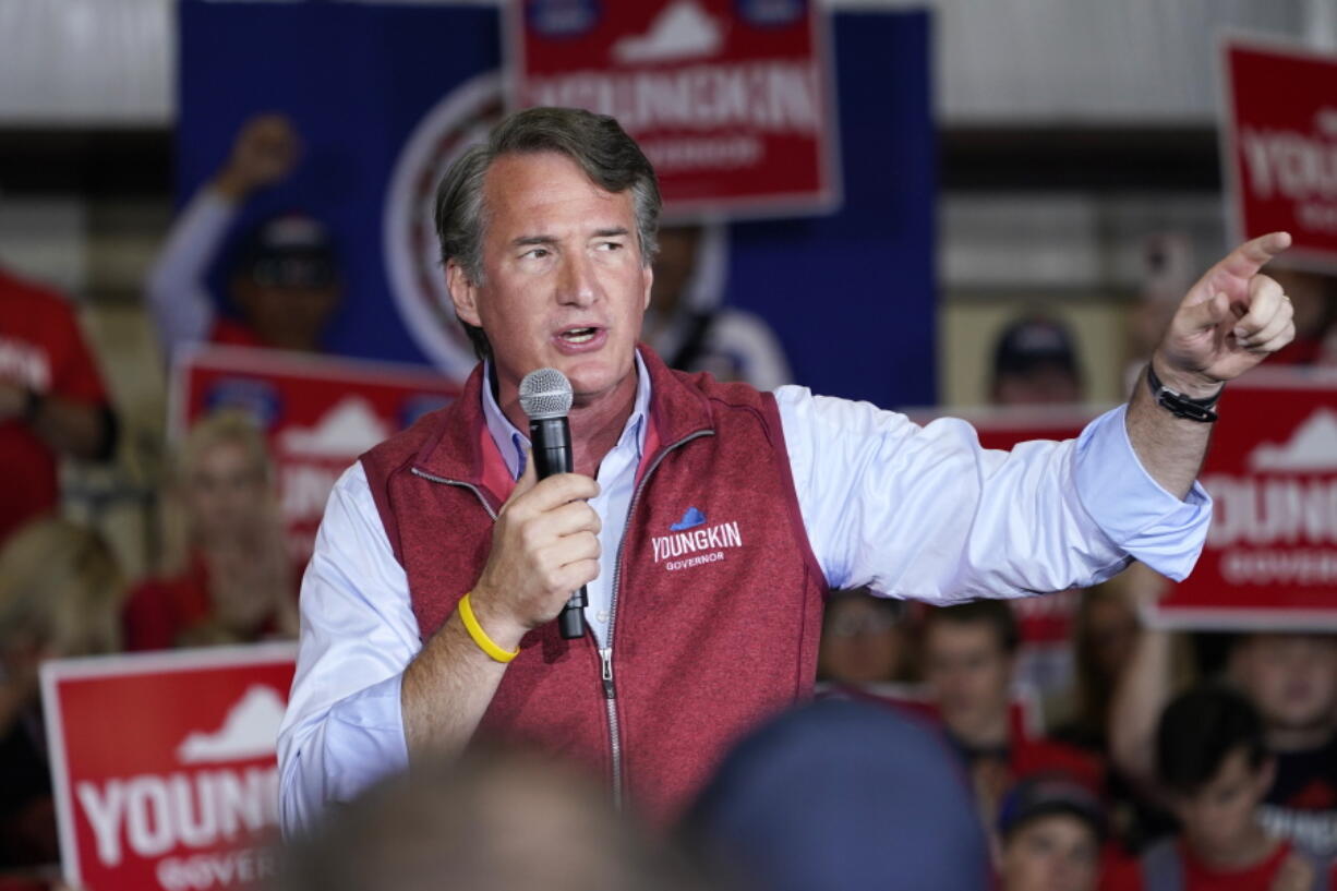 Republican gubernatorial candidate Glenn Youngkin gestures as he speaks to supporters during a rally in Chesterfield, Va., Monday, Nov. 1, 2021. Youngkin will face Democrat former Gov. Terry McAuliffe in the November election.