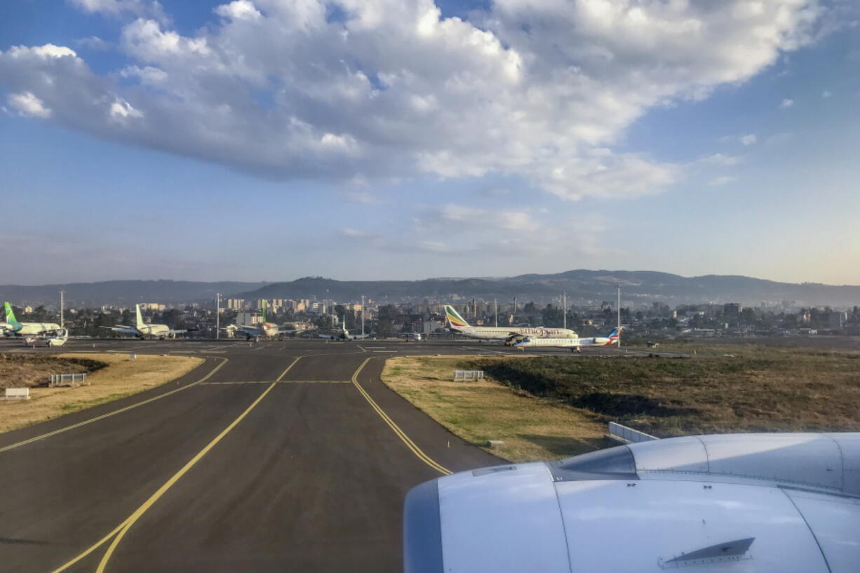 Planes sit on the tarmac at Bole International Airport in Addis Ababa, Ethiopia Wednesday, March 10, 2021. The United States Federal Aviation Administration warned pilots on Wednesday, Nov. 17, 2021 that planes operating at the airport could be "directly or indirectly exposed to ground weapons fire and/or surface-to-air fire," citing the "ongoing clashes" between Ethiopian forces and fighters from the northern Tigray region.