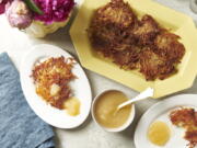 Plates of potato pancakes, or latkes, are displayed in New York in August 2020. Latkes are the food most traditionally associated with Hanukkah. There are all kinds of modern variations using other vegetables and other toppings. (Cheyenne M.