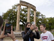 School students use a mobile app at the ancient site of Olympia, southwestern Greece, on Nov. 10.