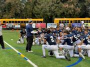 Skyview players and coaches gather on the field after defeating Kamiak on Saturday at Kiggins Bowl.