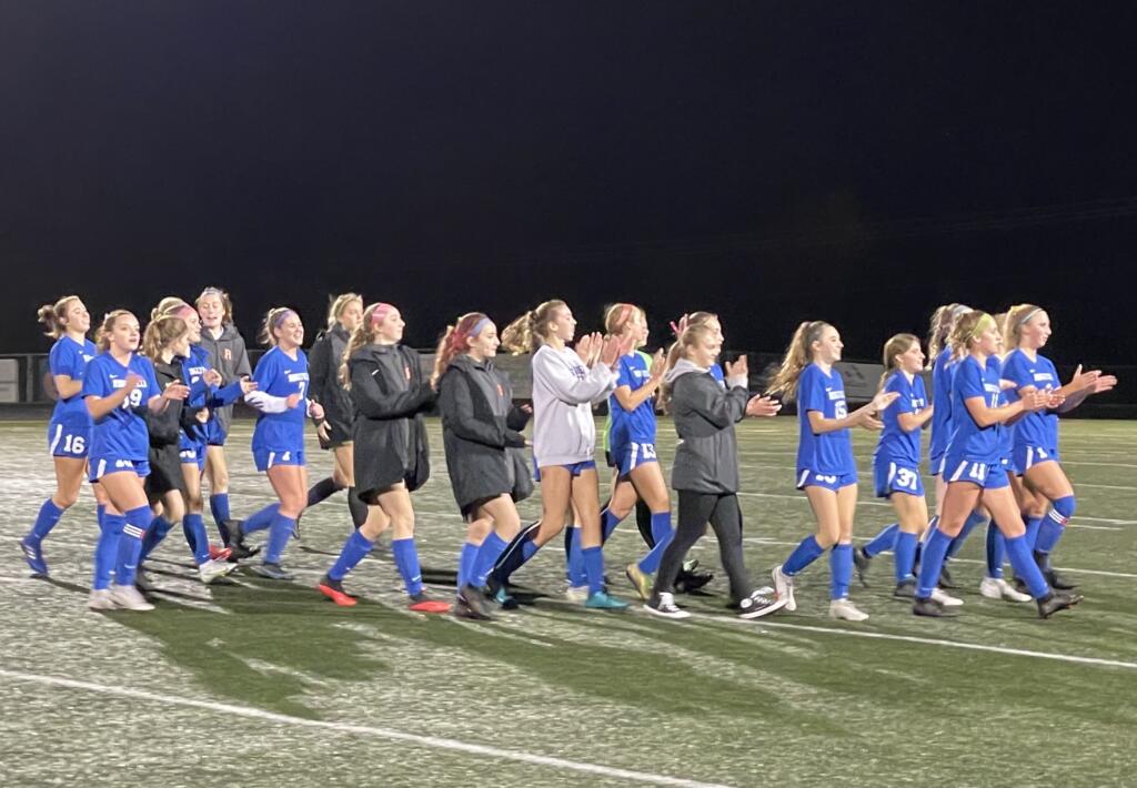 Ridgefield girls soccer players applaud their home fans after defeating Enumclaw 2-0 in the first round of the Class 2A playoffs Wednesday in Ridgefield.