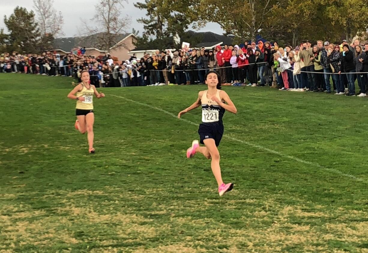 Alexis Leone of Seton Catholic sprints toward the finish line ahead of Meridian's Kayla Aalpoel to win the Class 1A state championship on Saturday at Sun Willows Golf Course in Pasco.