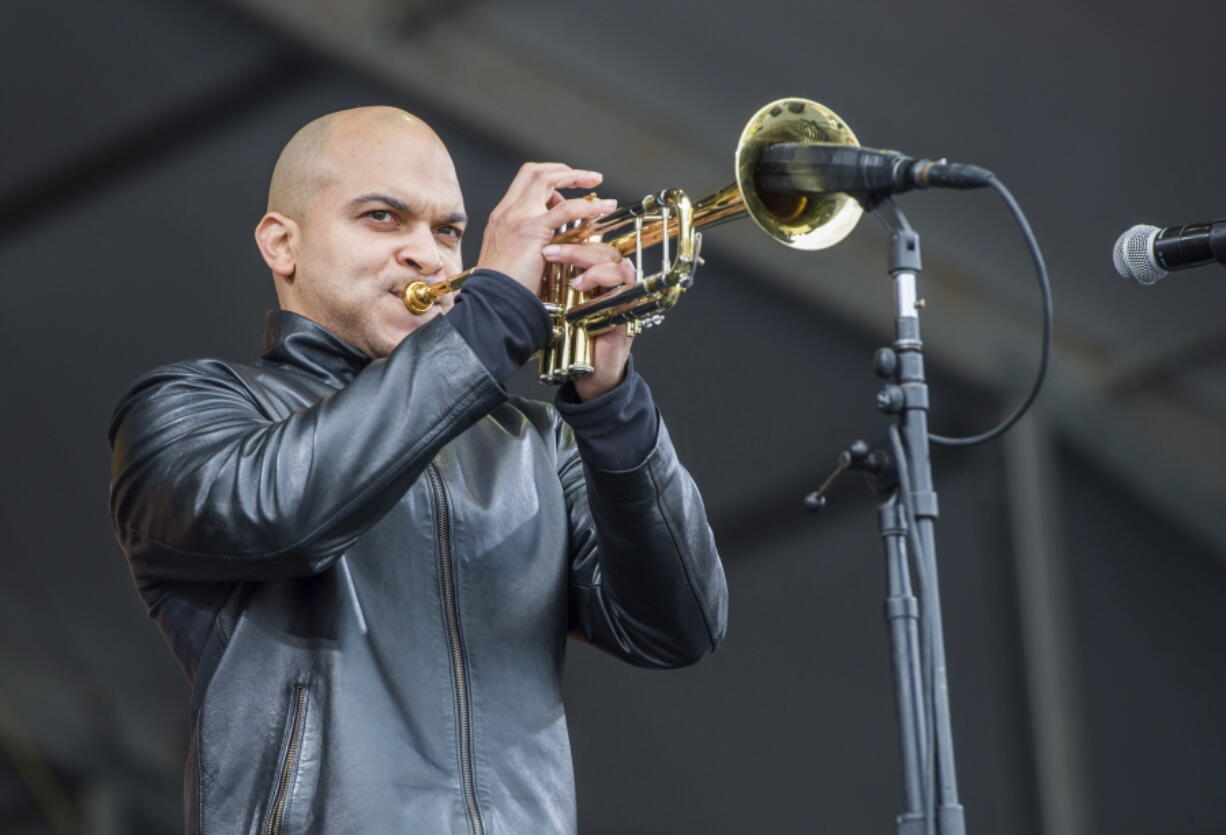 FILE - In this May 4, 2017 file photo, Irvin Mayfield performs at the New Orleans Jazz and Heritage Festival in New Orleans.  Mayfield, the jazz trumpet player who became a symbol of New Orleans resilience after Hurricane Katrina, was scheduled to be sentenced in federal court Wednesday, Nov.