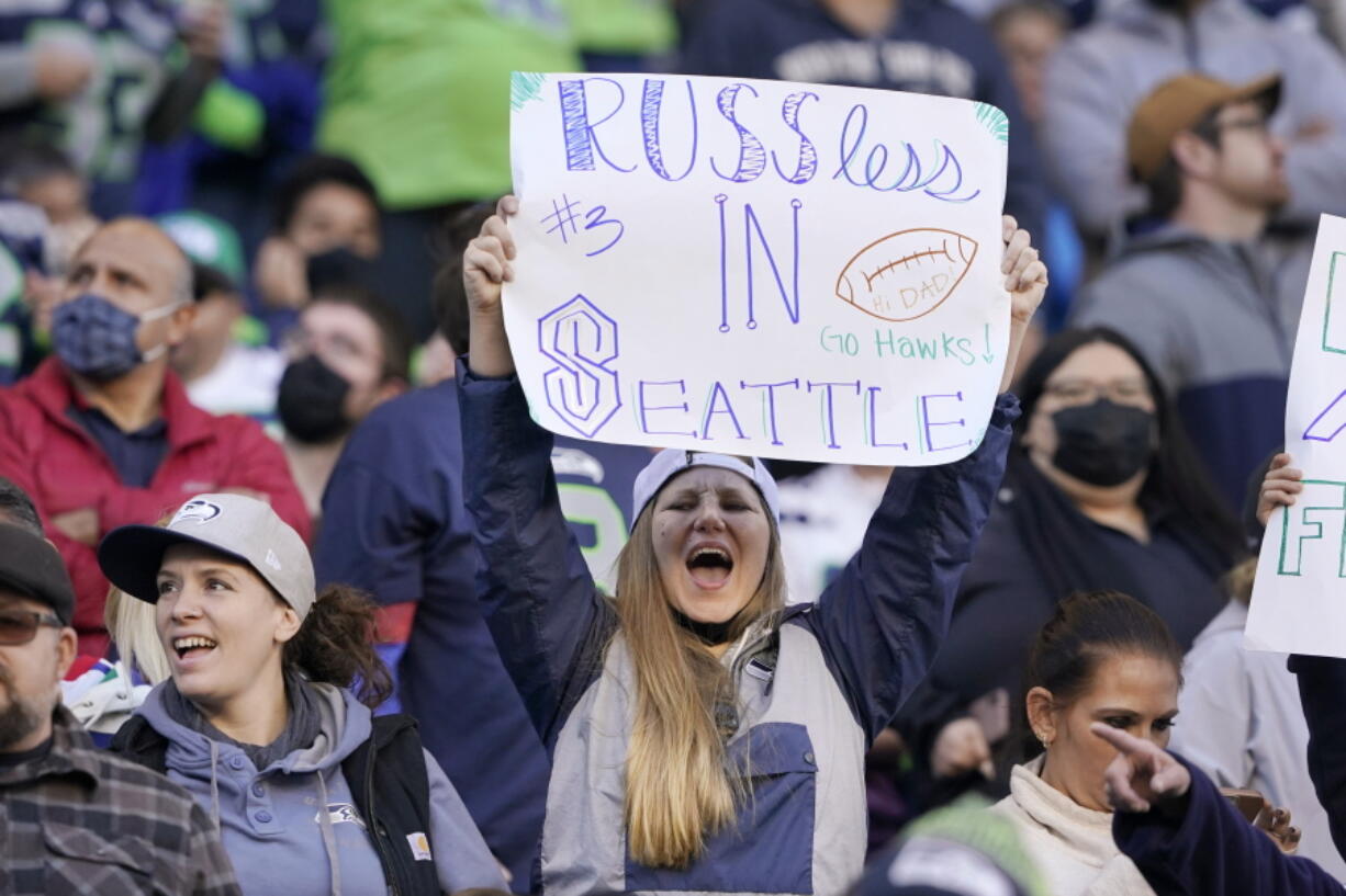 A Seattle Seahawks fans displays a "RUSSless in Seattle" sign, referring to the team's injured quarterback Russell Wilson, during a game against the Jacksonville Jaguars Oct. 31 in Seattle. (Ted S.