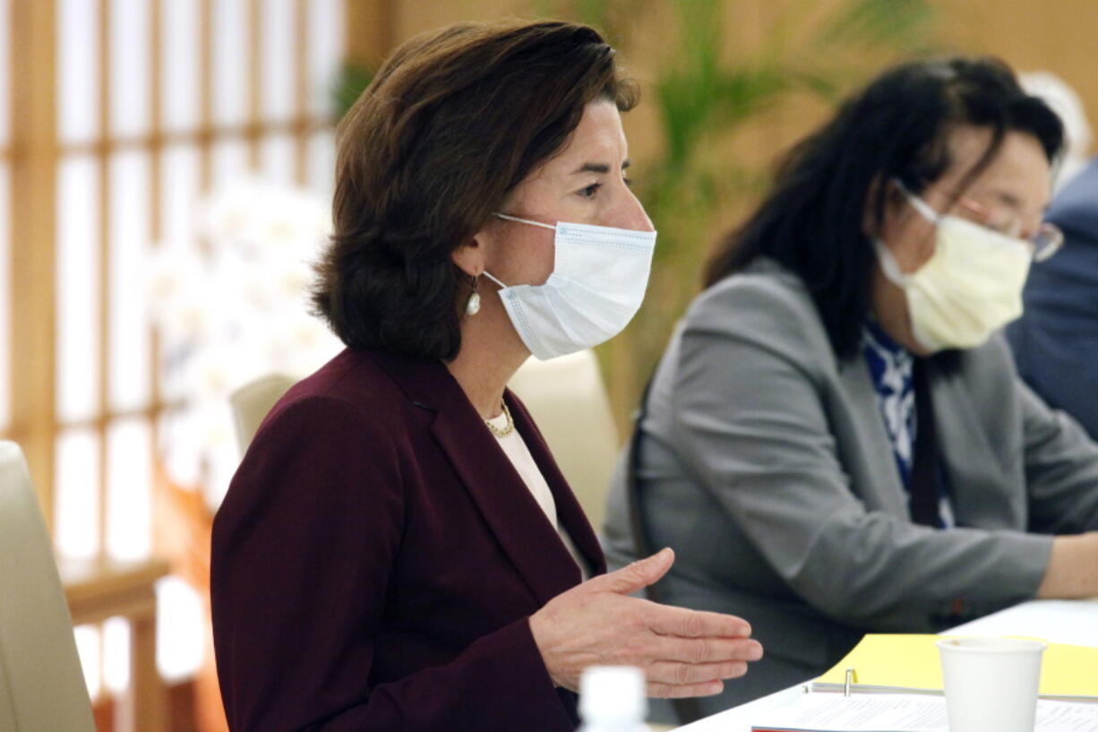 U.S. Secretary of Commerce Gina Raimondo talks with Japanese Foreign Minister Yoshimasa Hayashi during their meeting in Tokyo, Monday, Nov. 15, 2021. U.S. and Japanese officials agreed Monday to launch talks aimed at settling a dispute over American tariffs on imports of Japanese steel and aluminum.