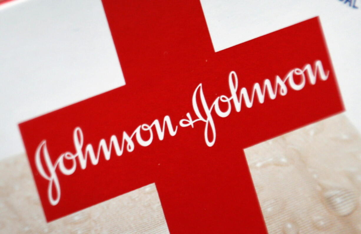 FILE - This Oct. 16, 2012 file photo shows the Johnson & Johnson logo on a package of Band-Aids, in St. Petersburg, Fla. Johnson & Johnson is splitting into two companies, separating the division that sells Band-Aids and Listerine, from its medical device and prescription drug business. The company selling prescription drugs and medical devices will keep Johnson & Johnson as its name, the company said Friday, Nov. 12, 2021.