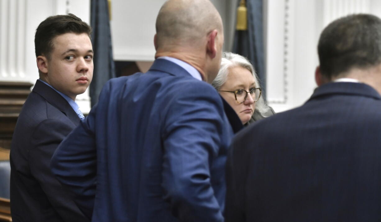 Kyle Rittenhouse looks back before going on a break during his trail at the Kenosha County Courthouse in Kenosha, Wis., on Monday, Nov. 15, 2021.