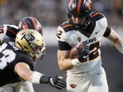 Oregon State's Jack Colletto, right, rushes for a touchdown as Colorado linebacker Joshka Gustav defends in the first half of an NCAA college football game Saturday, Nov. 6, 2021, in Boulder, Colo.