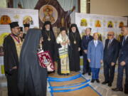 Ecumenical Patriarch Bartholomew of Constantinople leads the official door-opening ceremony of lower Manhattan's St. Nicholas Greek Orthodox Church on Tuesday, Nov. 2, 2021. The old St. Nicholas church was the only house of worship destroyed during the 9/11 attacks when it was crushed beneath the falling south tower.