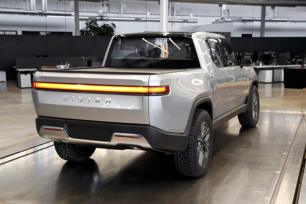 FILE - This Nov. 14, 2018, file photo shows a Rivian R1T at Rivian headquarters in Plymouth, Mich. Shares in Rivian Automotive are set to trade publicly on Wednesday, Nov. 10, 2021, and the world should get a better idea of just how hot investors are for the electric vehicle market.