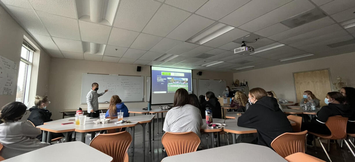 Clark College women’s soccer coach Peter Pickett goes over the match the Clark players are watching Wednesday. The result of match on the screen would determine Clark’s opponent on Saturday in the NWAC quarterfinals.