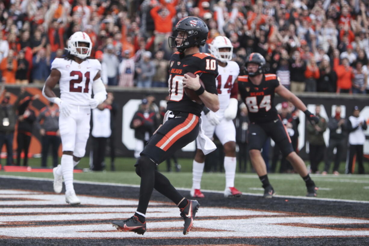 Oregon State quarterback Chance Nolan (10) runs into the end zone for a touchdown against Stanford during the first half of an NCAA college football game Saturday, Nov. 13, 2021, in Corvallis, Ore.