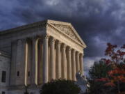 FILE - The Supreme Court is seen at dusk in Washington, Oct. 22, 2021. The Supreme Court is taking up challenges to a Texas law that has virtually ended abortion in the nation's second largest state after six weeks of pregnancy. The justices are hearing arguments Monday, Nov. 1, in two cases over whether abortion providers or the Justice Department can mount federal court challenges to the law, which has an unusual enforcement scheme its defenders argue shield it from federal court review. (AP Photo/J.