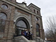 Montana Jewish Project President Rebecca Stanfel, left, and Jewish community member Erin Vang, right, leave the old synagogue Thursday in Helena, Mont. The nonprofit Montana Jewish Project purchased the building, originally built as Temple Emanu-El in 1891, from the Helena Catholic Diocese, which bought the building in 1981.