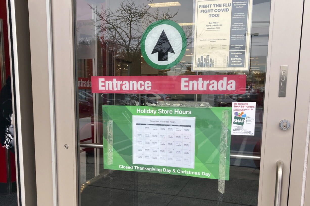 A sign at the entrance to a Target in Clifton, New Jersey, on Monday, November 22, 2021, announces the store will be closed on Thanksgiving. Target will no longer open its stores on Thanksgiving Day, making permanent a shift to the unofficial start of the holiday season that was suspended during the pandemic.