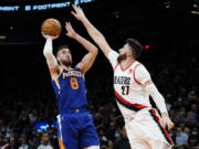 Phoenix Suns forward Frank Kaminsky (8) shoots over Portland Trail Blazers center Jusuf Nurkic (27) during the second half of an NBA basketball game, Wednesday, Nov. 10, 2021, in Phoenix.