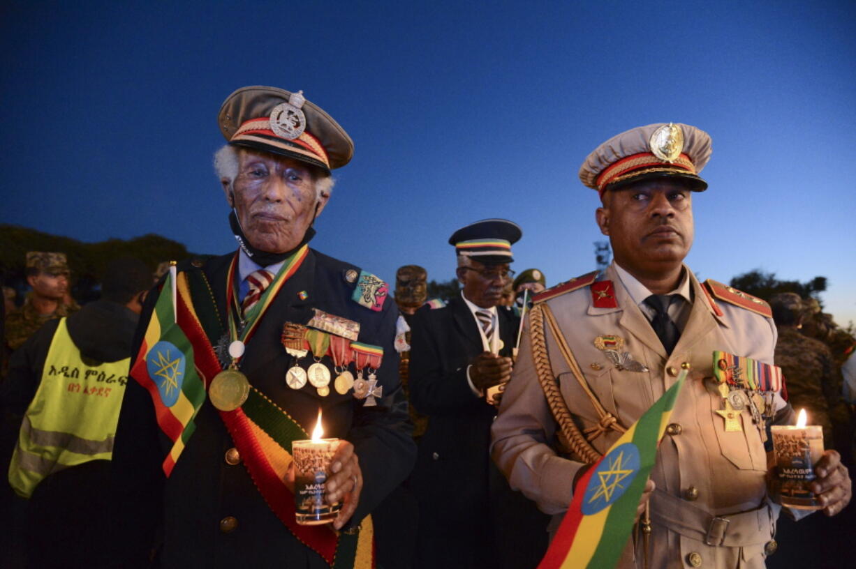 FILE - Current and former Ethiopian military personnel and the public commemorate federal soldiers killed by forces loyal to the Tigray People's Liberation Front (TPLF) at a candlelight event in Addis Ababa, Ethiopia, Wednesday, Nov. 3, 2021. The U.N. Security Council has called for an end to the intensifying and expanding conflict in Ethiopia, and for unhindered access for humanitarian aid to tackle the world's worst hunger crisis in a decade in the war-torn Tigray region.