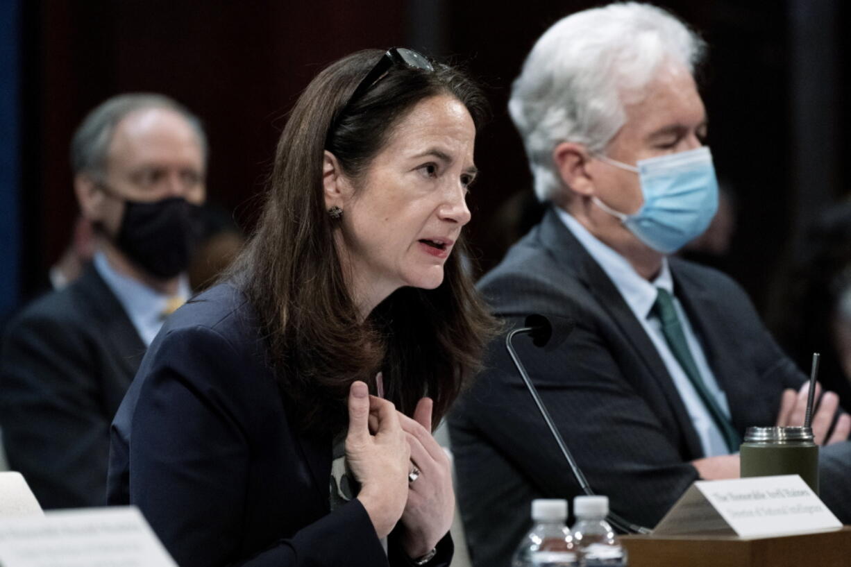 FILE - Director of National Intelligence Avril Haines, left, next to CIA Director William Burns, testifies at a House Intelligence committee hearing on diversity and equity in the intelligence community on Oct. 27, 2021, on Capitol Hill in Washington. Thousands of intelligence officers could soon face dismissal for failing to comply with the U.S. government's vaccine mandate, leading to concerns from Republican lawmakers about potentially hurting agencies considered critical to national security. Haines says she doesn't anticipate the mandate affecting the mission of national security agencies.