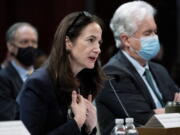 FILE - Director of National Intelligence Avril Haines, left, next to CIA Director William Burns, testifies at a House Intelligence committee hearing on diversity and equity in the intelligence community on Oct. 27, 2021, on Capitol Hill in Washington. Thousands of intelligence officers could soon face dismissal for failing to comply with the U.S. government's vaccine mandate, leading to concerns from Republican lawmakers about potentially hurting agencies considered critical to national security. Haines says she doesn't anticipate the mandate affecting the mission of national security agencies.