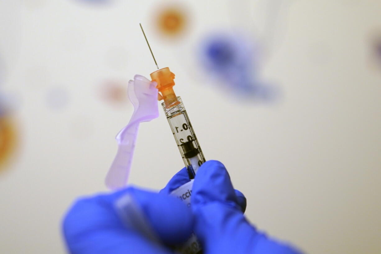 A child's dose of the COVID-19 vaccination is shown Wednesday at Children's National Hospital in Washington. The vaccine, one-third the dose for teens and adults, requires two shots three weeks apart.