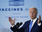 FILE - President Joe Biden speaks about COVID-19 vaccinations after touring a Clayco Corporation construction site for a Microsoft data center in Elk Grove Village, Ill., Thursday, Oct. 7, 2021. The fate of Biden's vaccine mandate for larger private employers may come down to a lottery that determines which federal circuit court will consider the matter. Conservative groups have filed challenges to the rule in right-leaning courts, while unions that argue the rule doesn't go far enough have done so in left-leaning courts. The multiple cases are expected to be consolidated, and it will be up to a random drawing - expected on Tuesday, Nov.