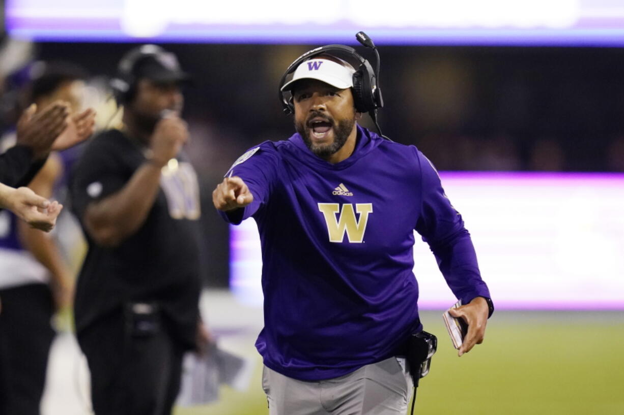 FILE - Washington head coach Jimmy Lake yells toward the field in the first half of an NCAA college football game against California, Saturday, Sept. 25, 2021, in Seattle. Washington on Monday, Nov. 8 suspended head coach Jimmy Lake for one game without pay following a sideline incident during the Huskies' game against Oregon.