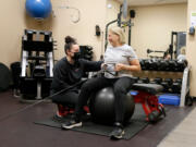 Mo Golden, NASM CPT, works Dec. 14 with Marcia Ouellette 80,of Upper Arlington at Personal Level Fitness in Columbus, Ohio. (Barbara J.