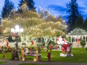 Lights and other holiday decorations fill the yard outside Susie's Country Inn for Dogs and Cats on Northeast 159th Street near Brush Prairie.