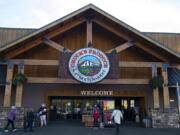 Shoppers come and go outside of Chuck's Produce & Street Market's east Vancouver location on Wednesday morning. Both locations of the popular local grocery store are listed for sale.