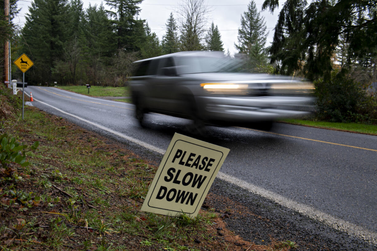 A motorist navigates a narrow section of Allworth Road east of Battle Ground on Tuesday morning. Residents say the county's growing population is making rural roads unsafe.