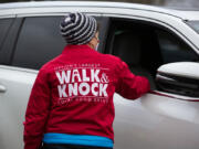 Janet Elliott, sector coordinator for Walk & Knock, greets a donor Dec. 4 at Hudson's Bay High School, which was a drop-off site for food donations as the Walk & Knock food drive became Drive & Drop for the second year because of the pandemic.