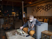 Portland resident Marco McLean enjoys a relaxing morning while visiting Bula Kava House in Southeast Portland. The bar's owner is planning a second location in downtown Vancouver.