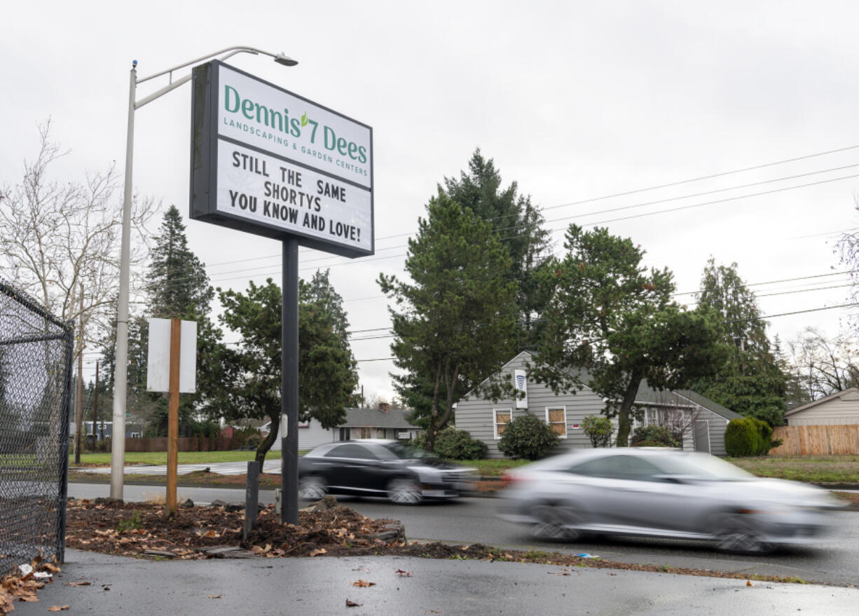 Cars drive past a sign for the newly renamed Dennis' 7 Dees, formerly Shorty's Garden Center, on Friday at 10006 S.E. Mill Plain Blvd. The popular garden center has been owned by Dennis' 7 Dees for the past five years and is now taking its owner's brand.